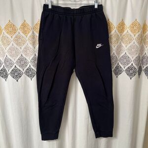 Nike black sweatpants with white embroidered swoosh